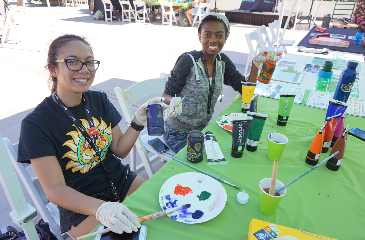 capture.png Girls painting metal cans