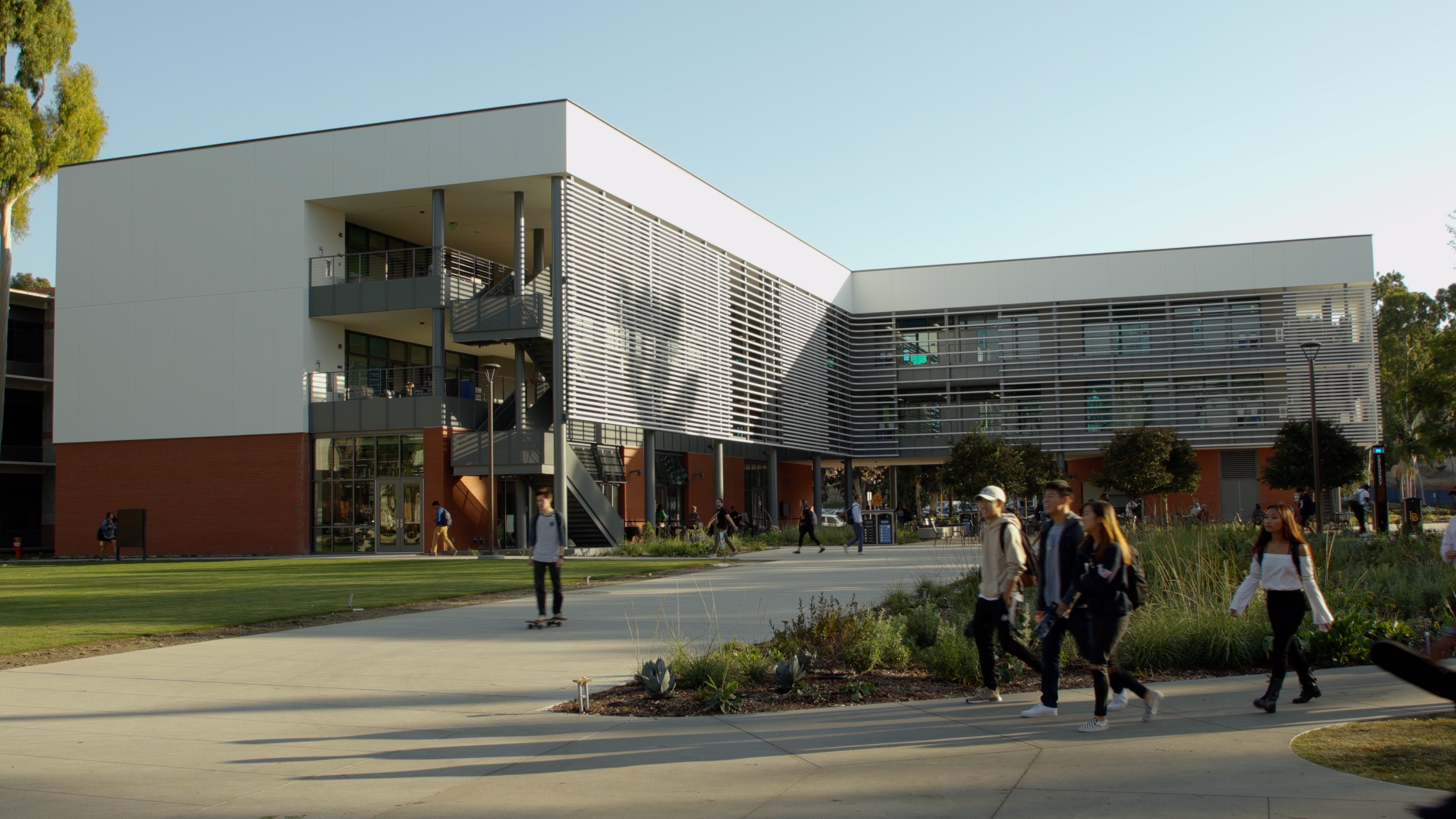Students walk past the new CCPE building.