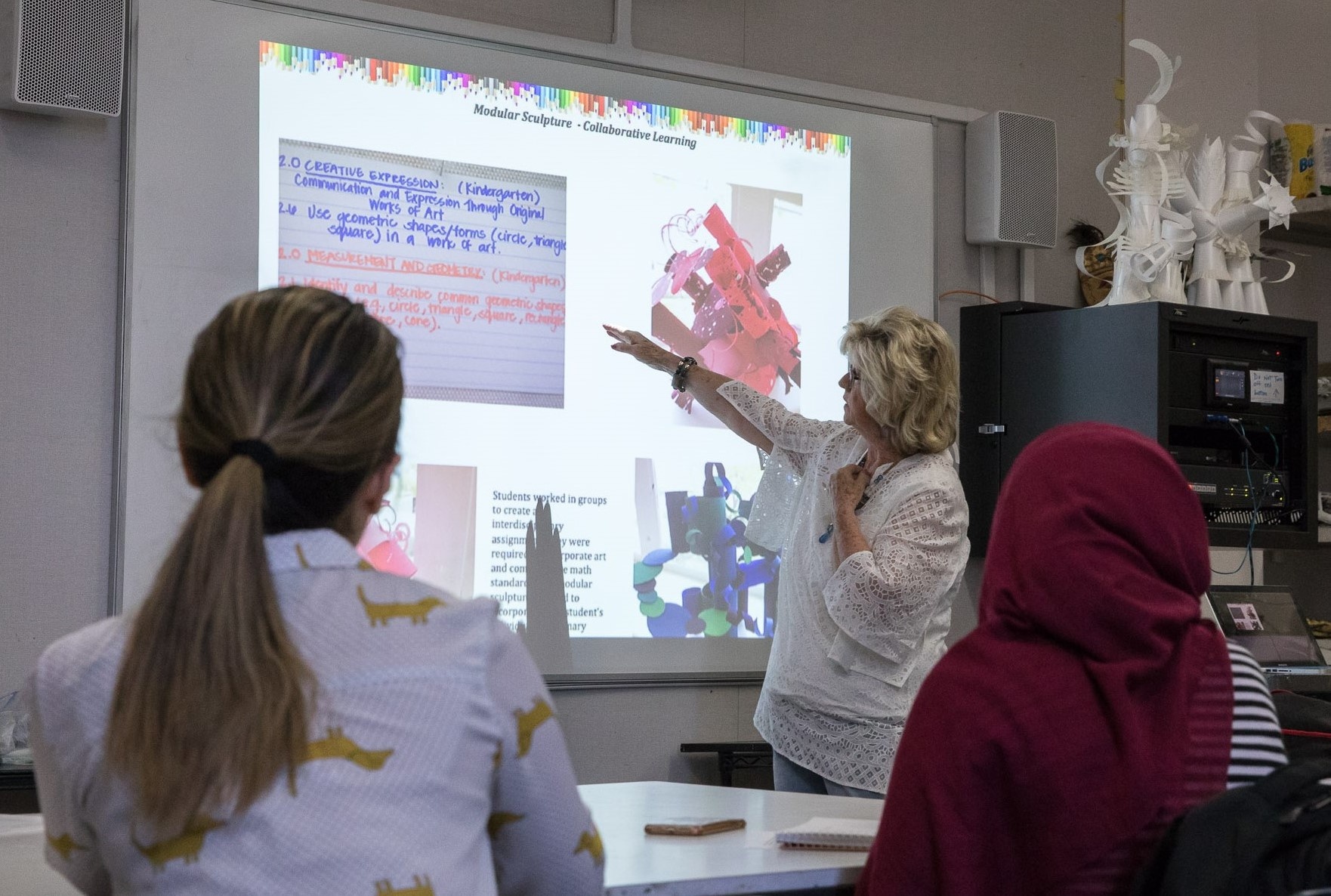 Professor presenting in front of a class