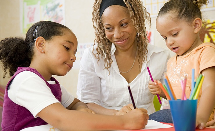 Preschool teacher with children