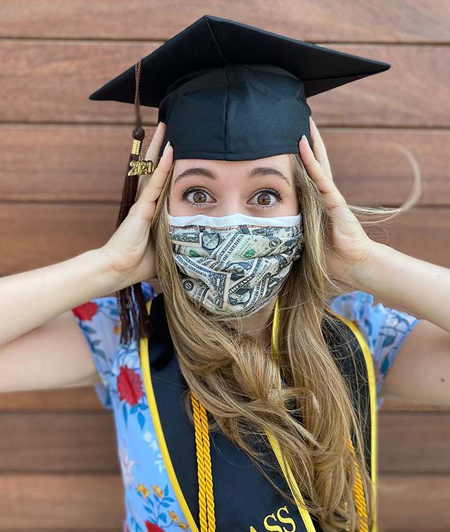 Recent graduate in front o her laptop