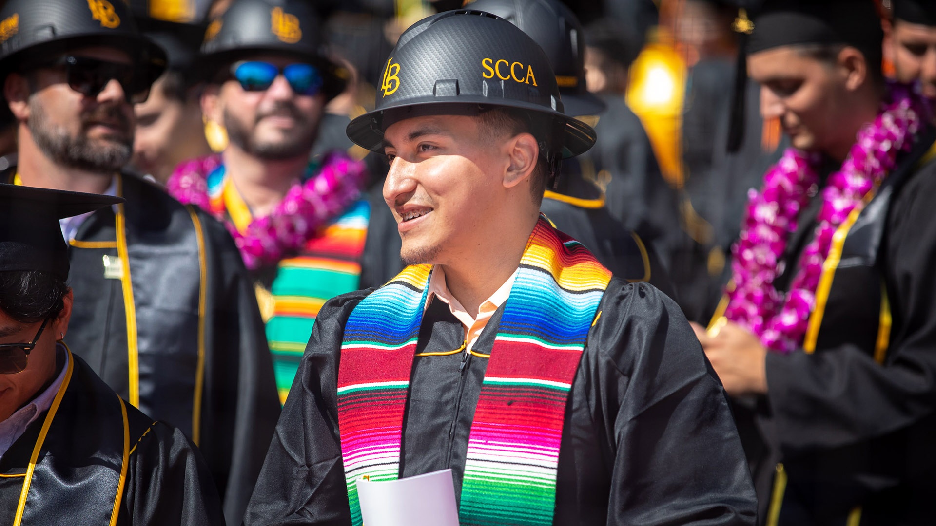 commencement-coe-hero3_1.jpg College of Engineering graduate wears black hard hat cap du