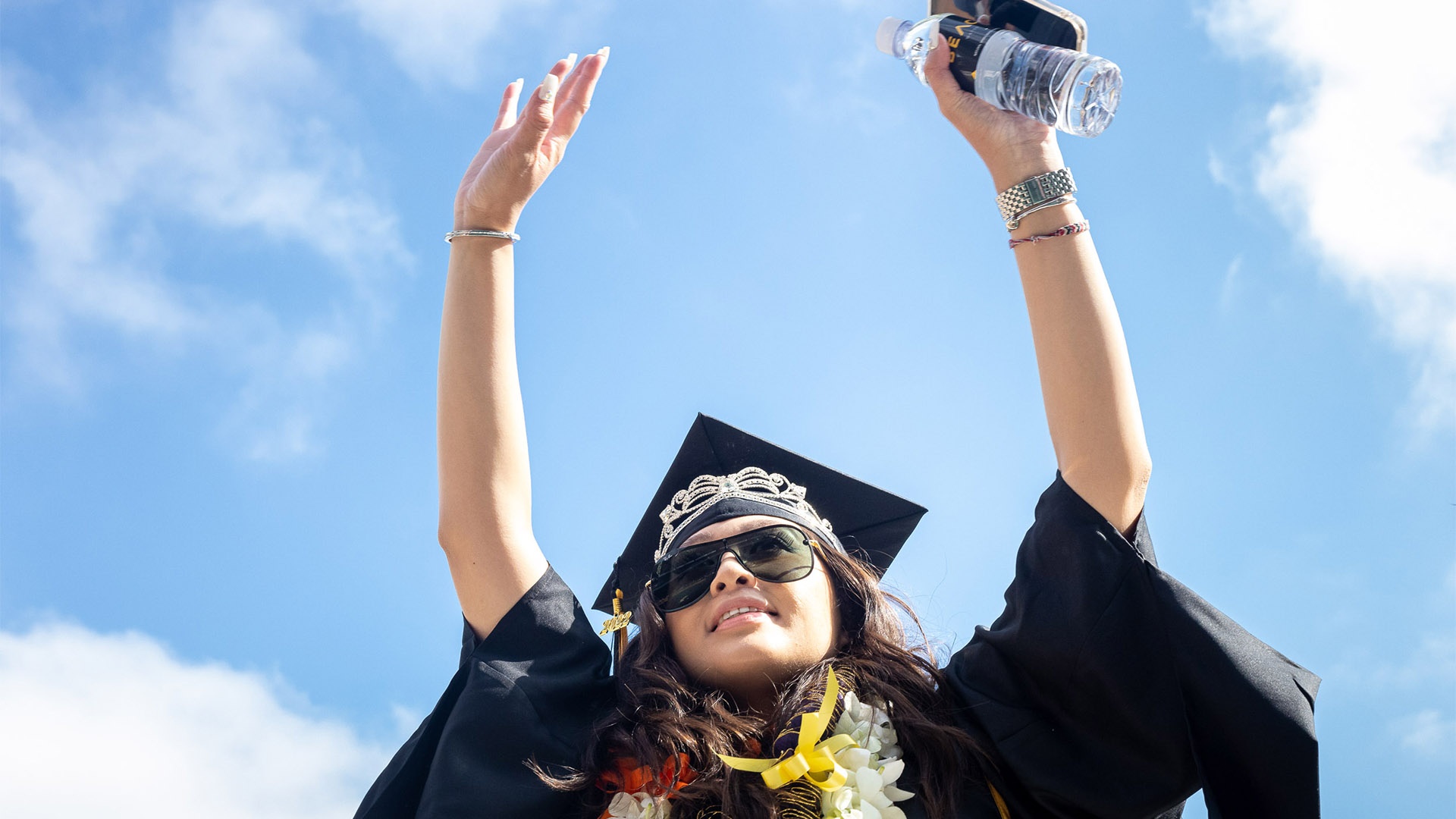 commencement-coe-hero6.jpg A smiling College of Engineering graduate, wearing a tiara o