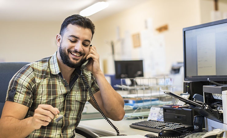 Business man in office talking on the phone