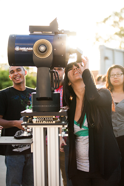 A student using a telescope