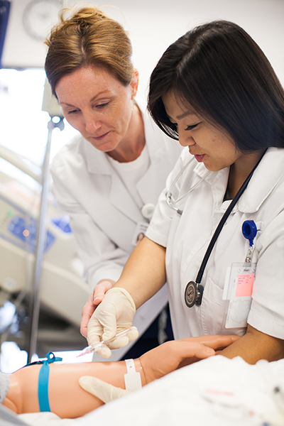 content_beach-roadmap_second-year.jpg A student and teacher practice health care