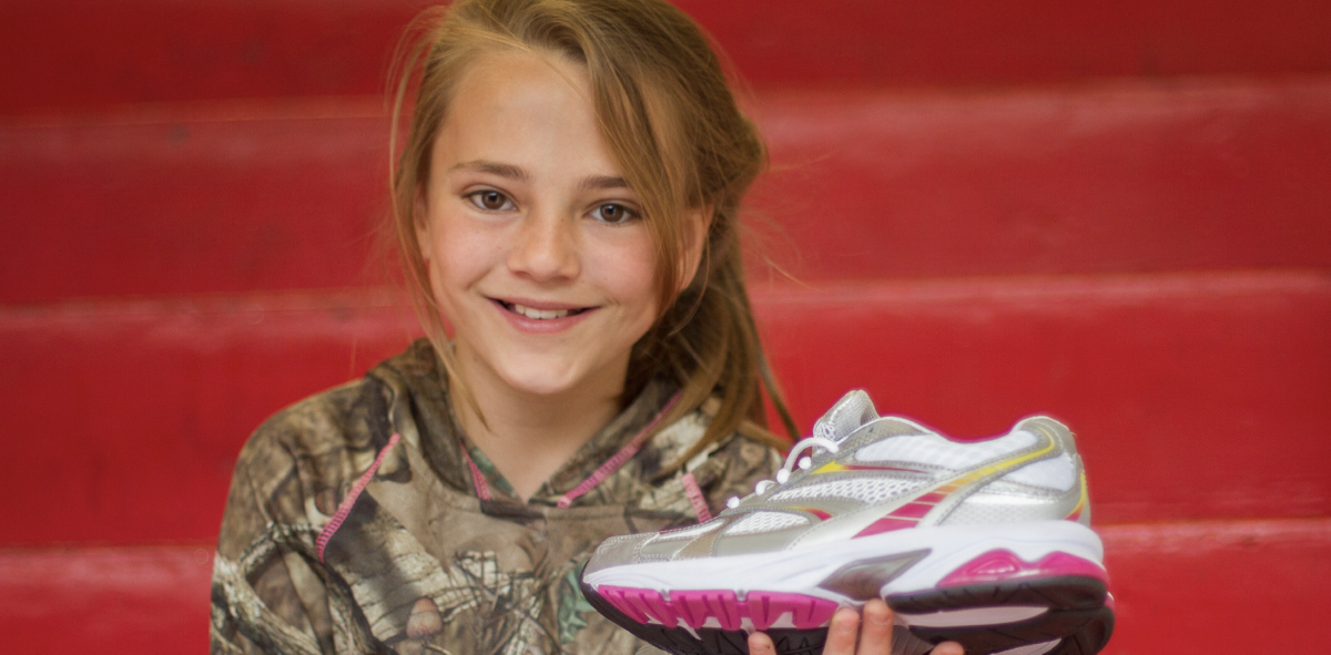 content_provost_provost-shoe-drive.png Child with Shoe