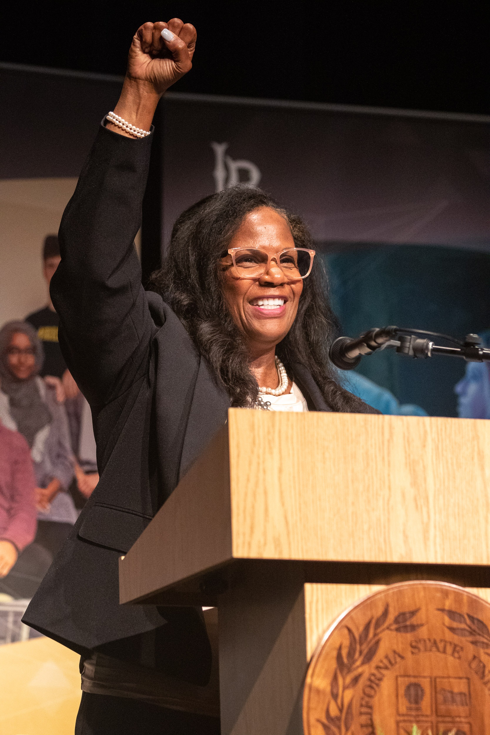 Provost Karyn Scissum Gunn raises fist