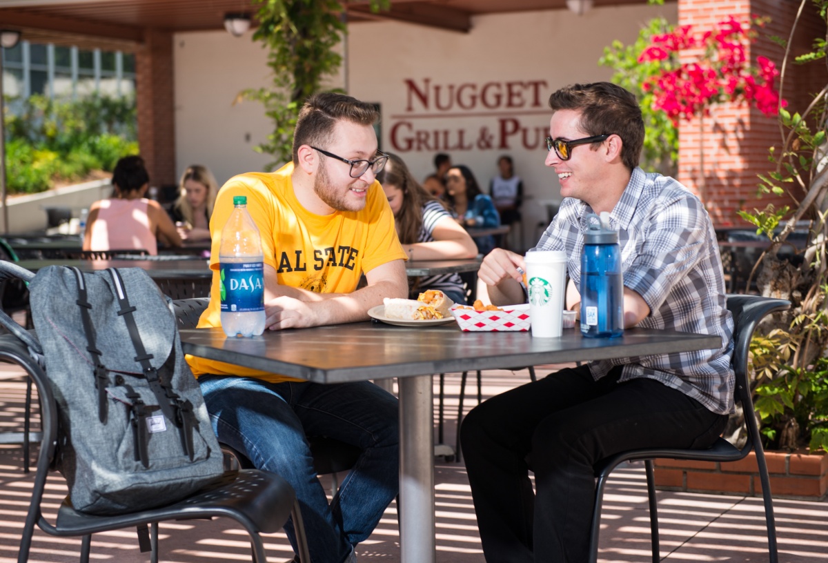 csulb_tapingo_01.jpg Students enjoying a meal at The Nugget.