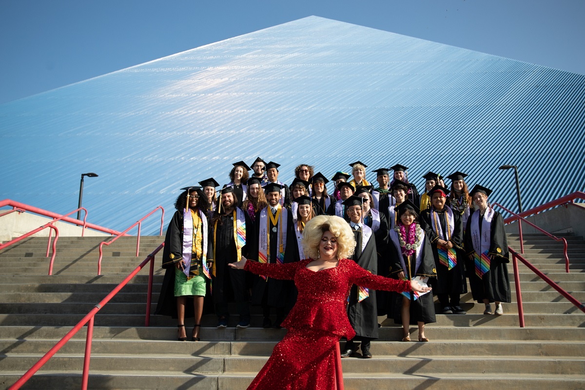 Grads pose in front of the Pyramid at the 2022 Lavender Cult