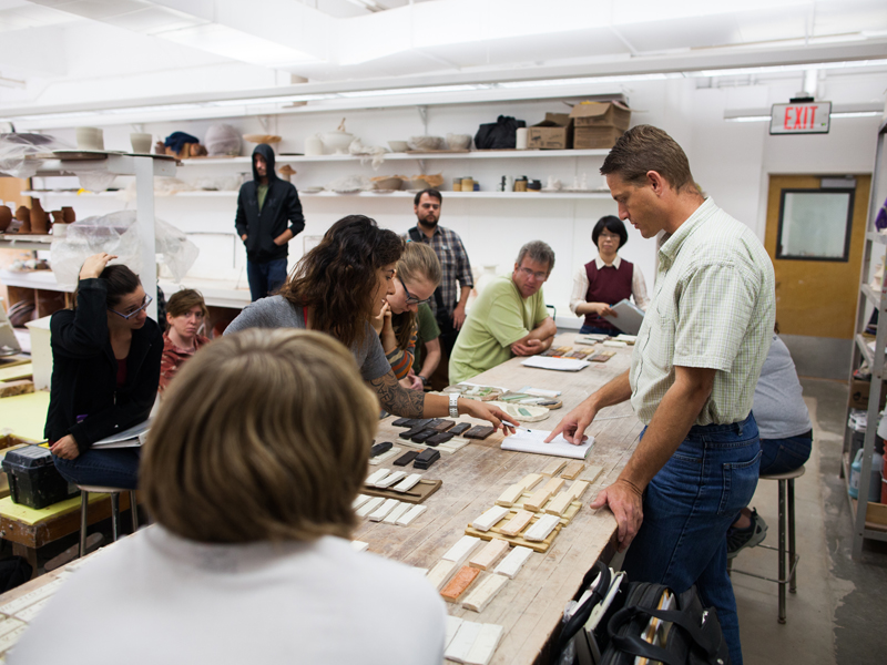 CSULB Ceramic Students get a lecture on material use.