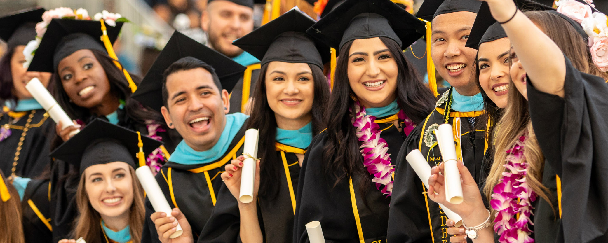 Students take picture at graduation ceremony