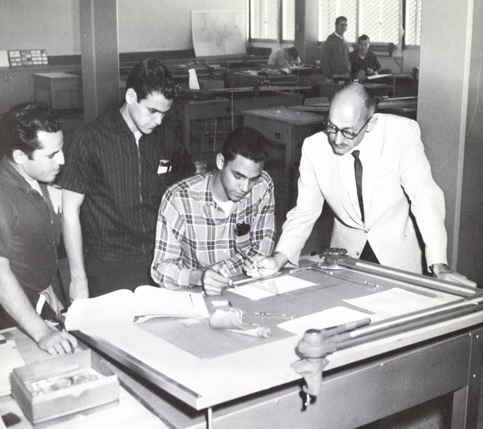 1962 Professor Lawence Kundis assists students with problems