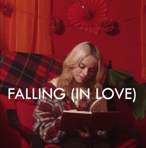 Falling in love movie still with girl writing in journal