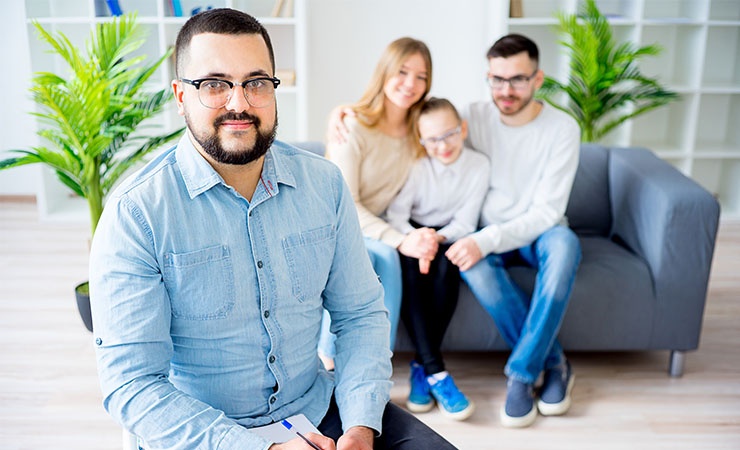 Family counselor sitting with family