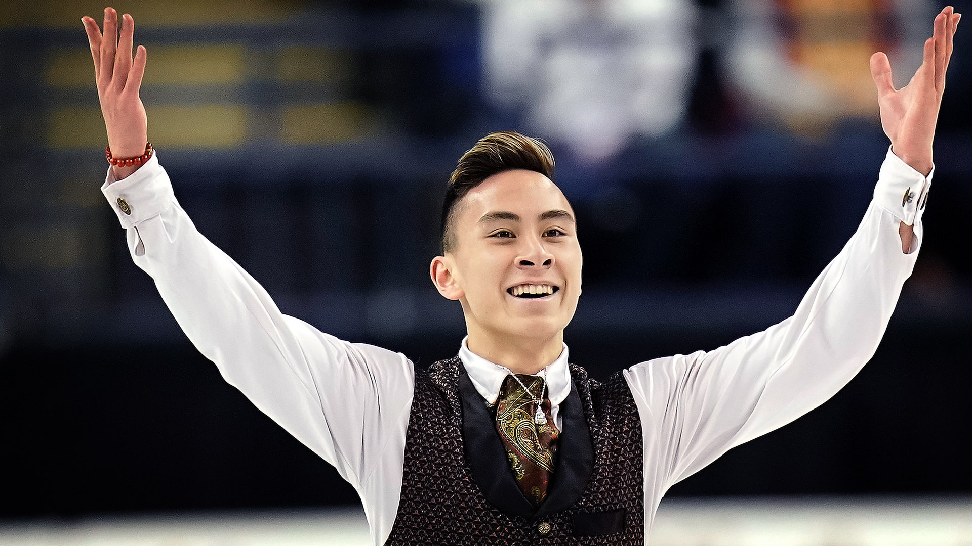 Dinh Tran raises his arms