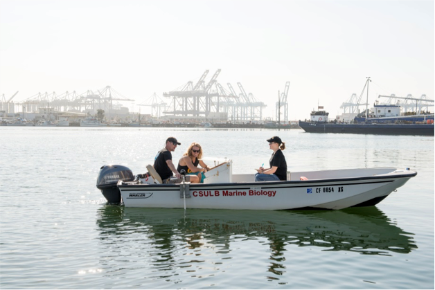 Fig. 18. Chris Lowe, Mike Farris, and Bonnie Ahr in a boat i