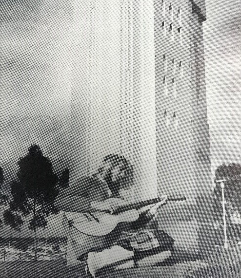student plays the guitar