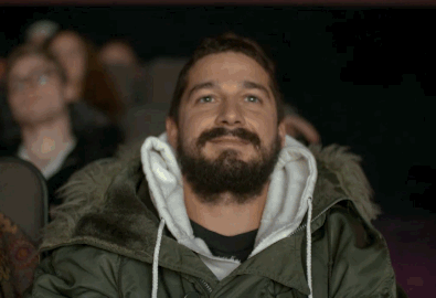 gif of shia lebouf laughing in a theater 