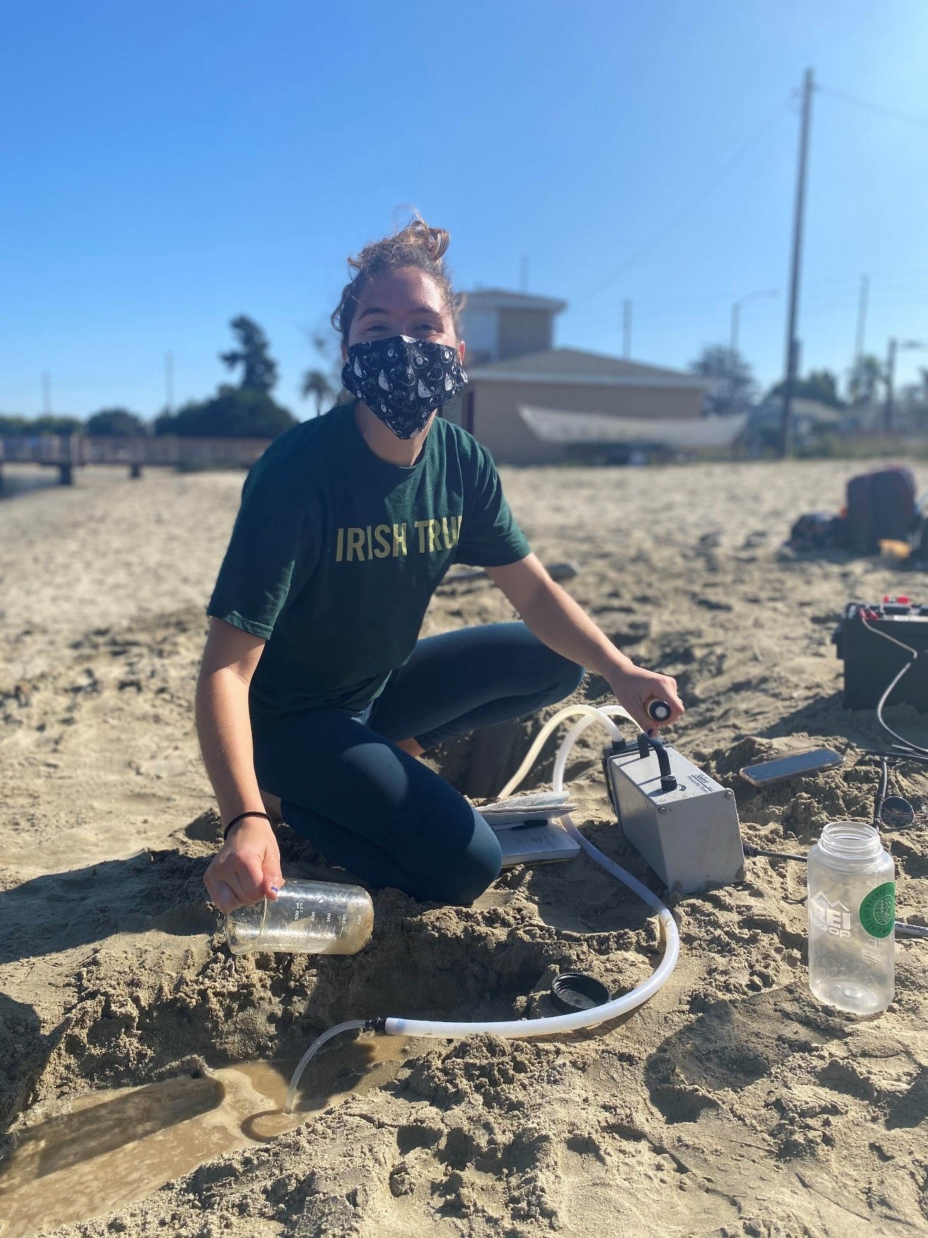 Graduate student collects water samples