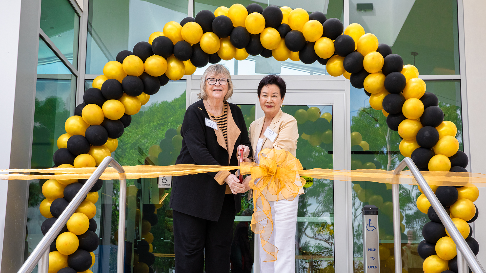 Jane Close Conoley, Anna Ngai at ribbon cutting