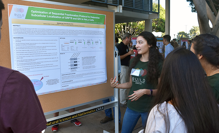 img-38.jpg Year One Scholar Stephanie Leal presenting her research.