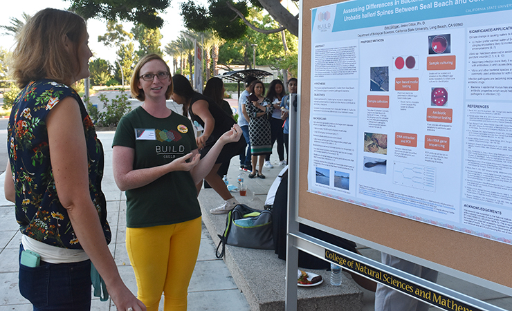 img-50.jpg Year One Scholar Ariel Gilligan explains her research.
