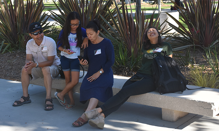 Amara Pouv hangs out with her family before the Symposium.