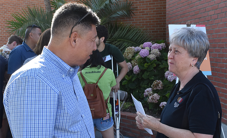 Dr. Simon Kim talks with Co-Principal Investigator Dr. Laura