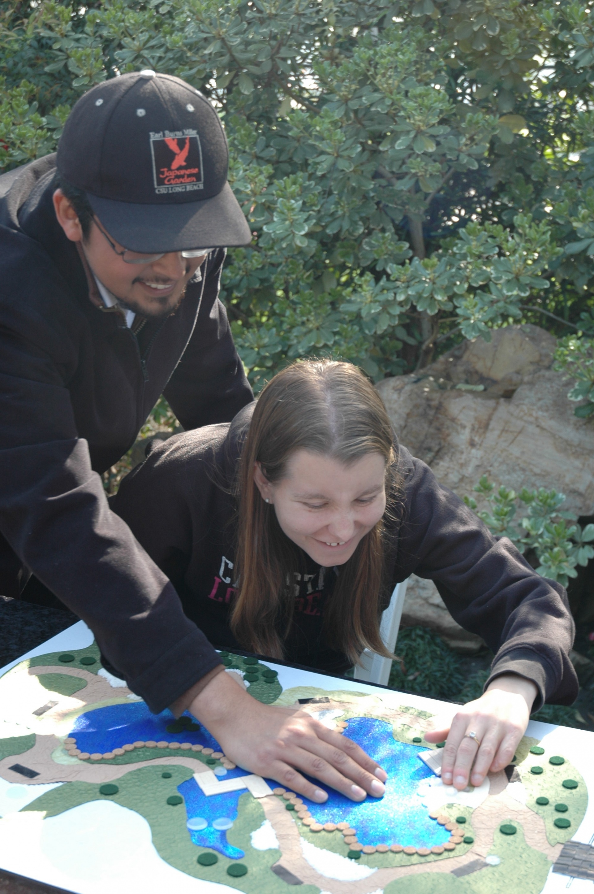 Javier and Penny exploring a 3d map of the Garden