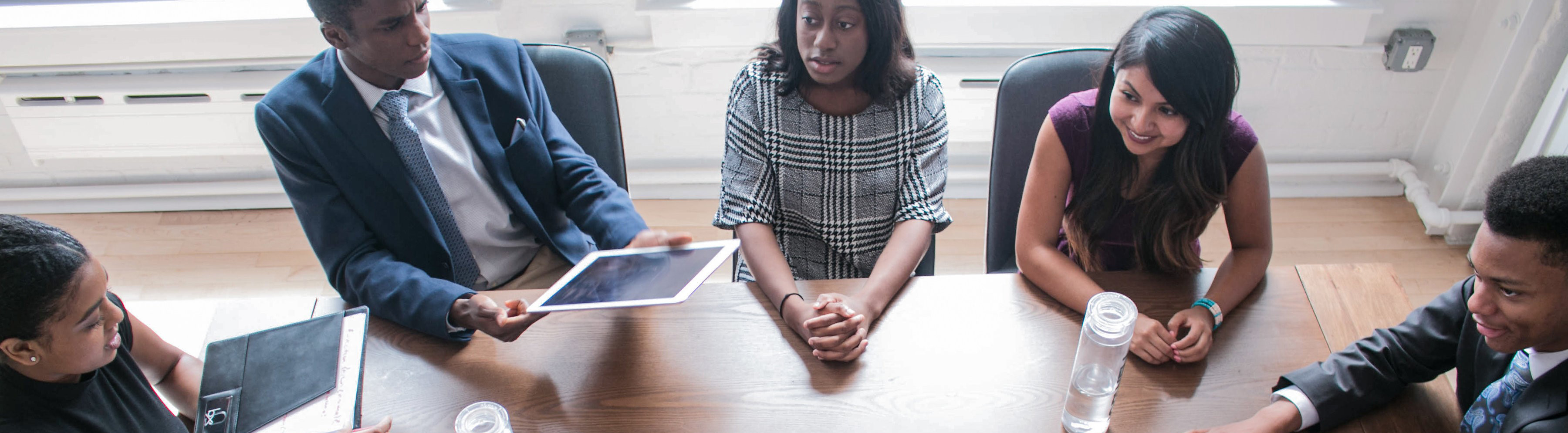 people sitting together at conference table