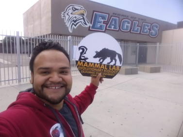 Max Amaya shows the Mammal Lab logo at South Junior High Sch