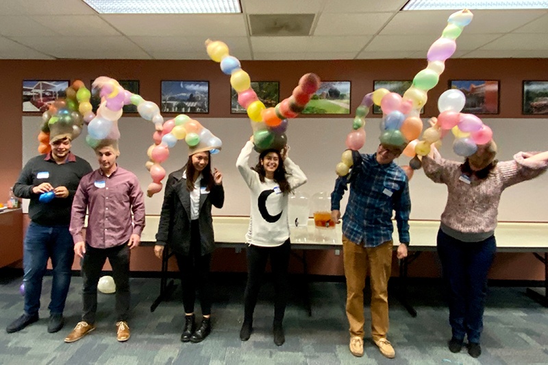 metric_family_mixer_2019_game_winners.jpg holiday hat winners displaying their creations