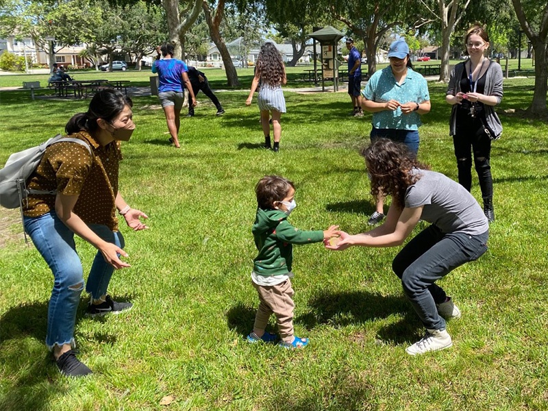 playing with small child in the park