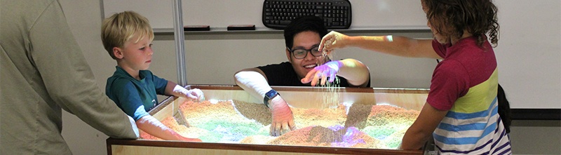 minibanner_cnsm_open_house.jpg children playing with interactive topological map