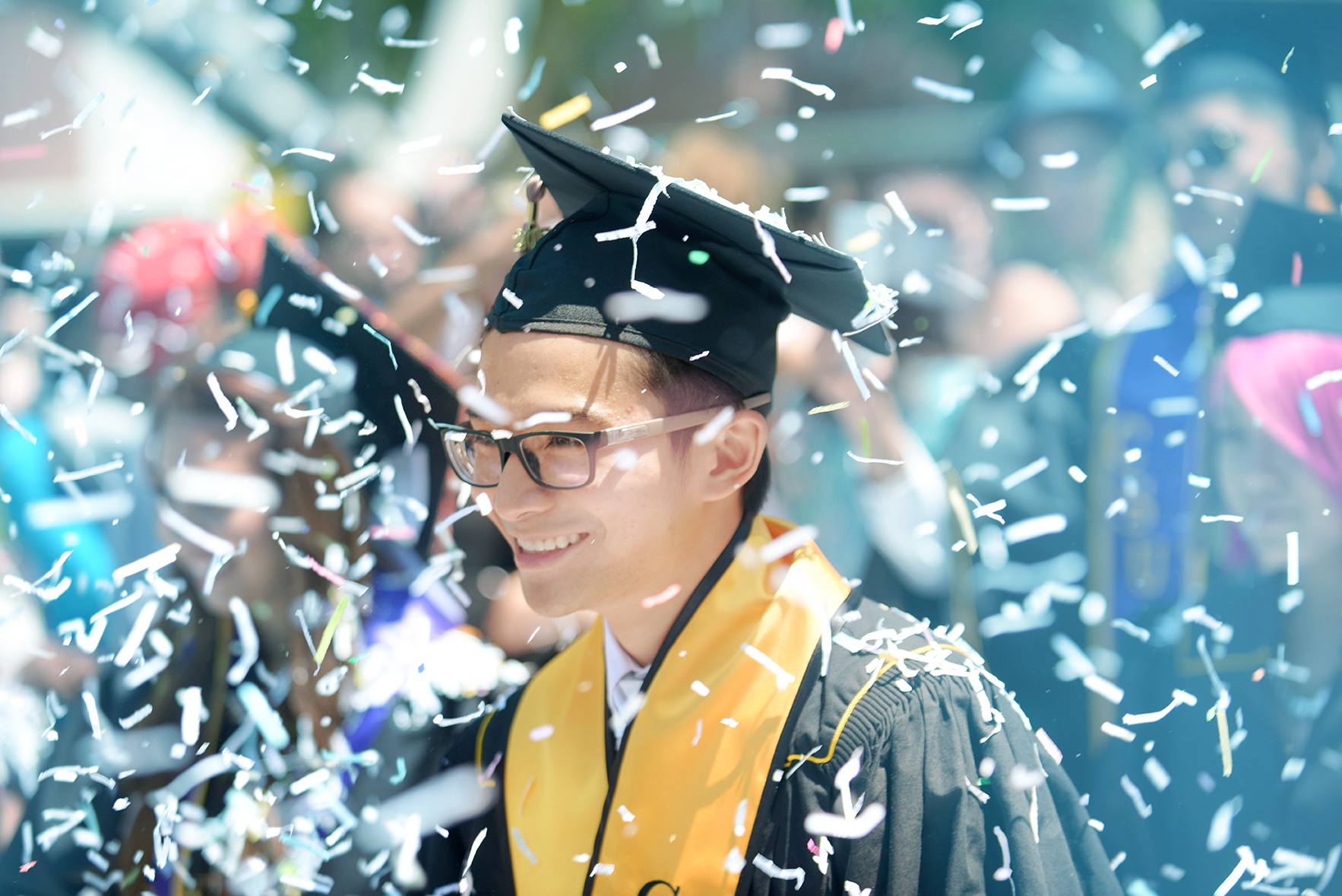 Student at Graduation with Confetti 
