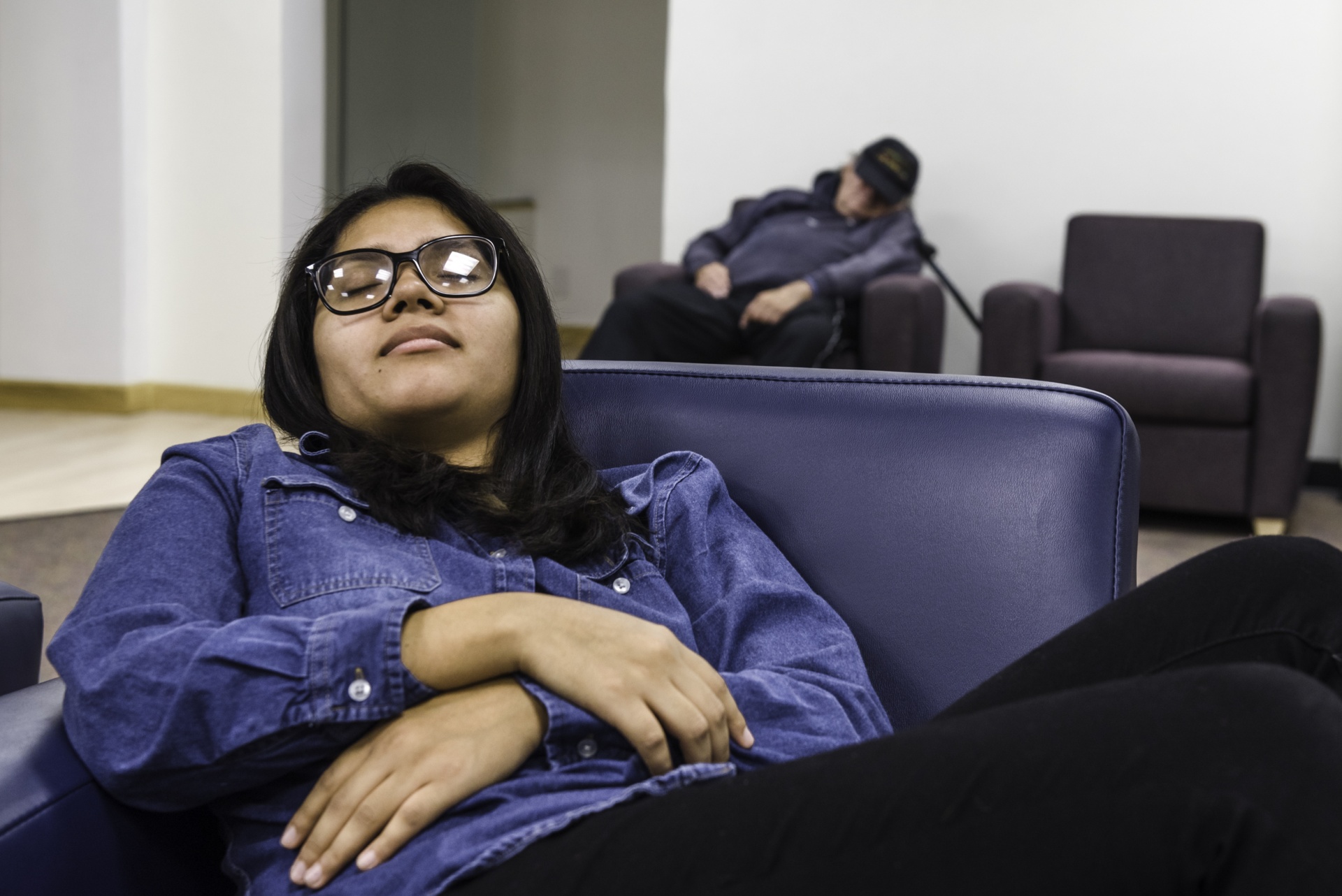 student sleeping at usu art museum