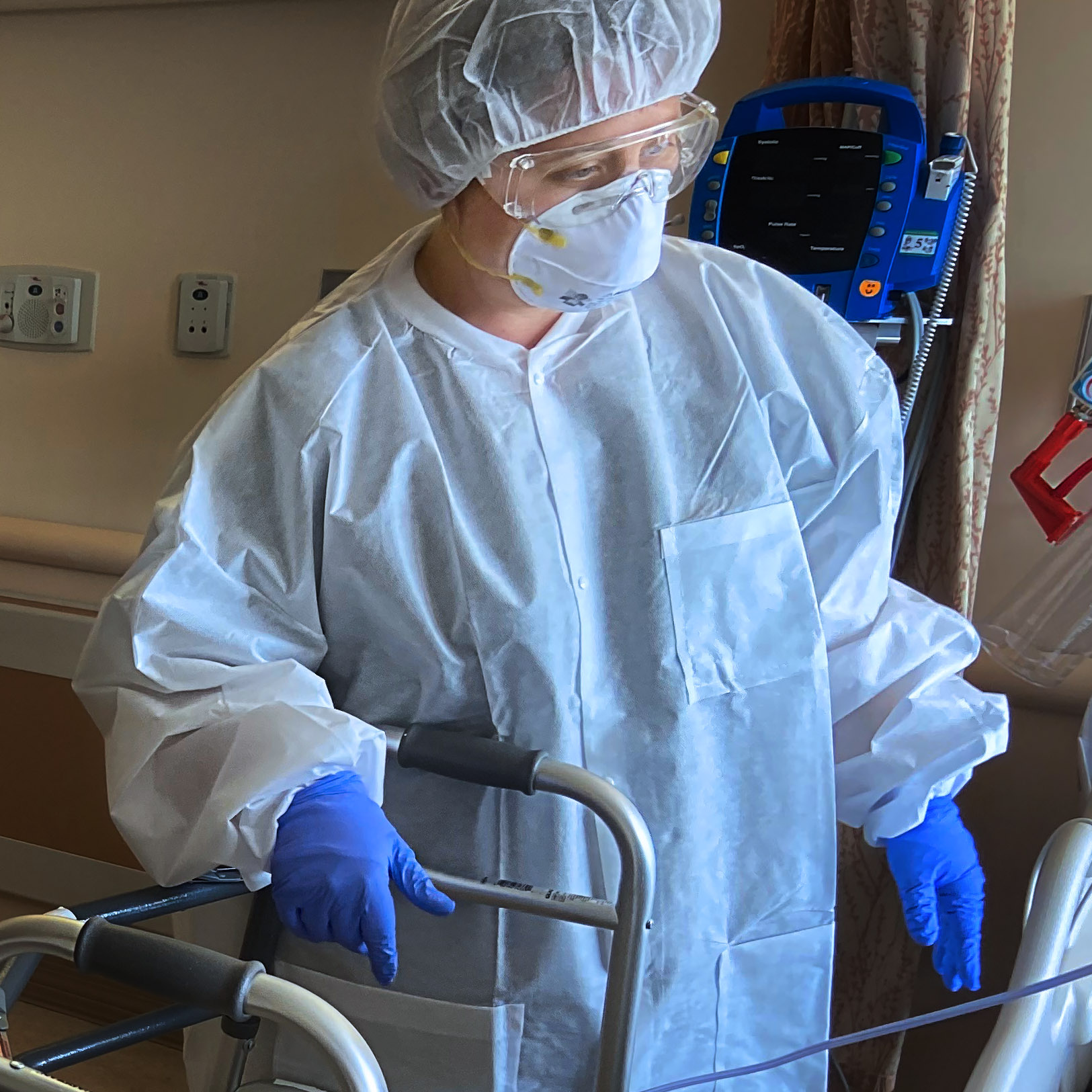 physical therapist veronica cherene checks on patient