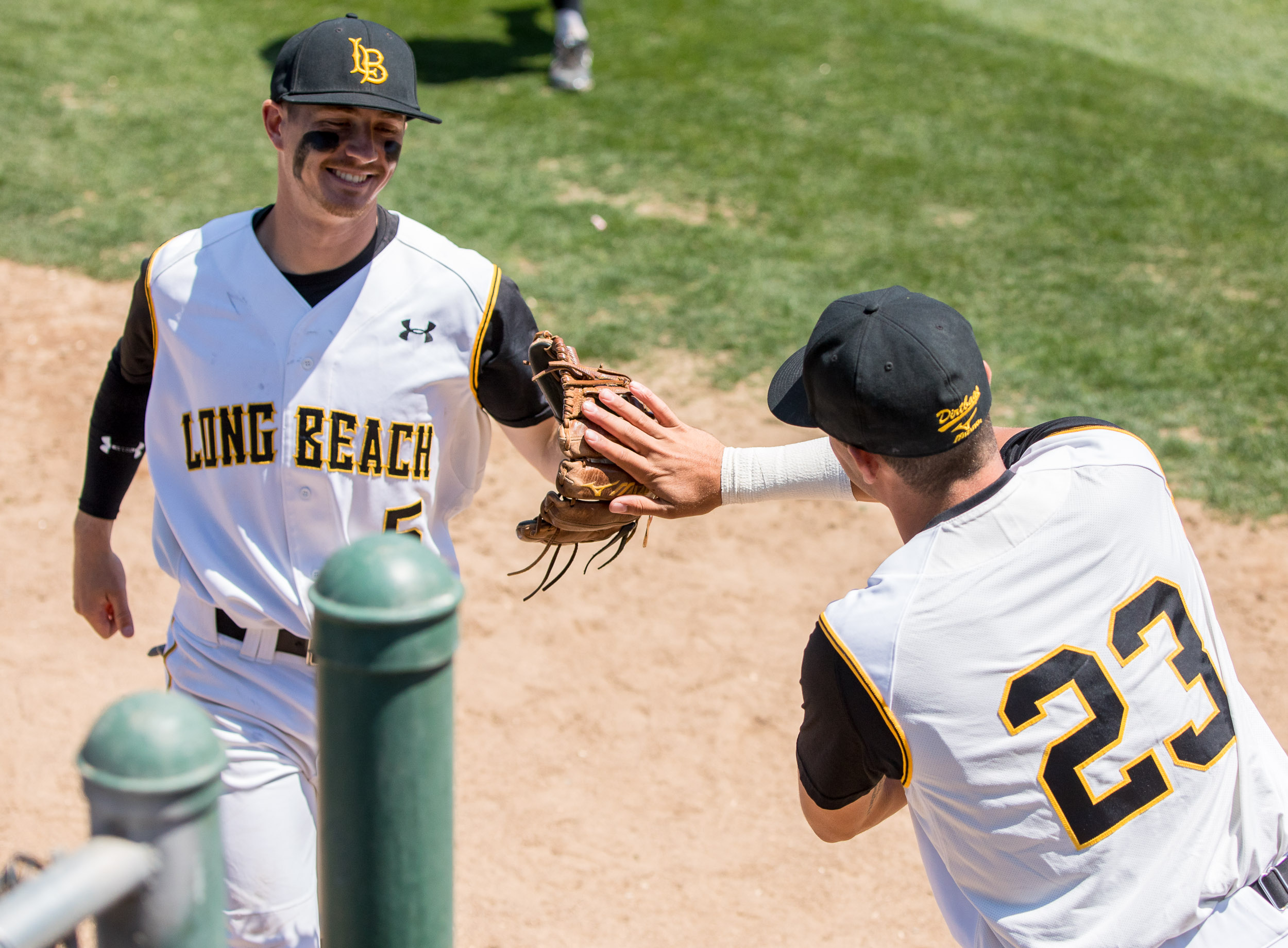 baseball players congratulating each other on field