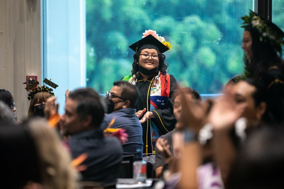 pacific_islander-01_rs.jpg A grad applauds at the 2022 Pacific Islander Cultural Comme