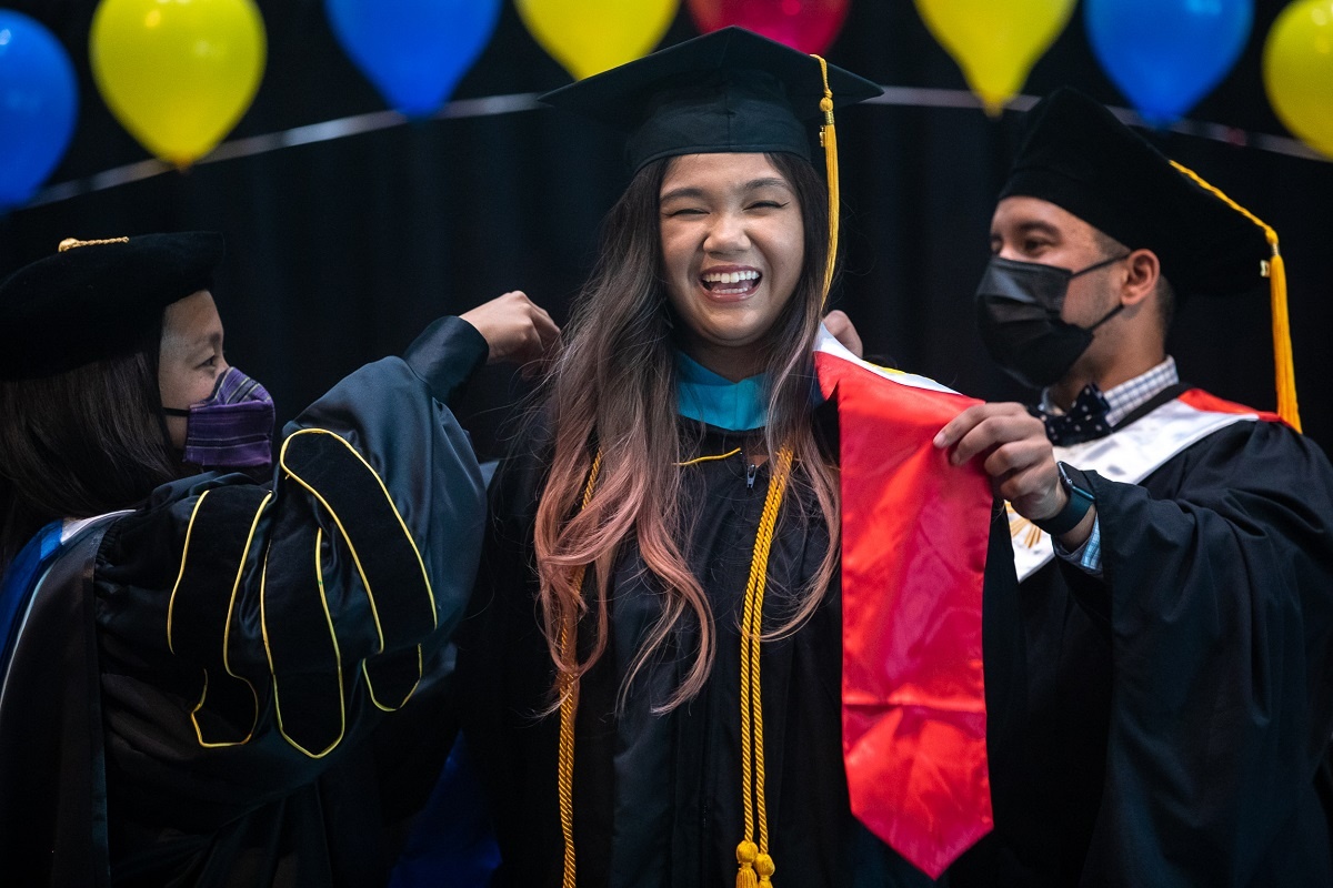 pilipino-01_rs.jpg A proud graduate poses at the 2022 Pilipino Cultural Commenc