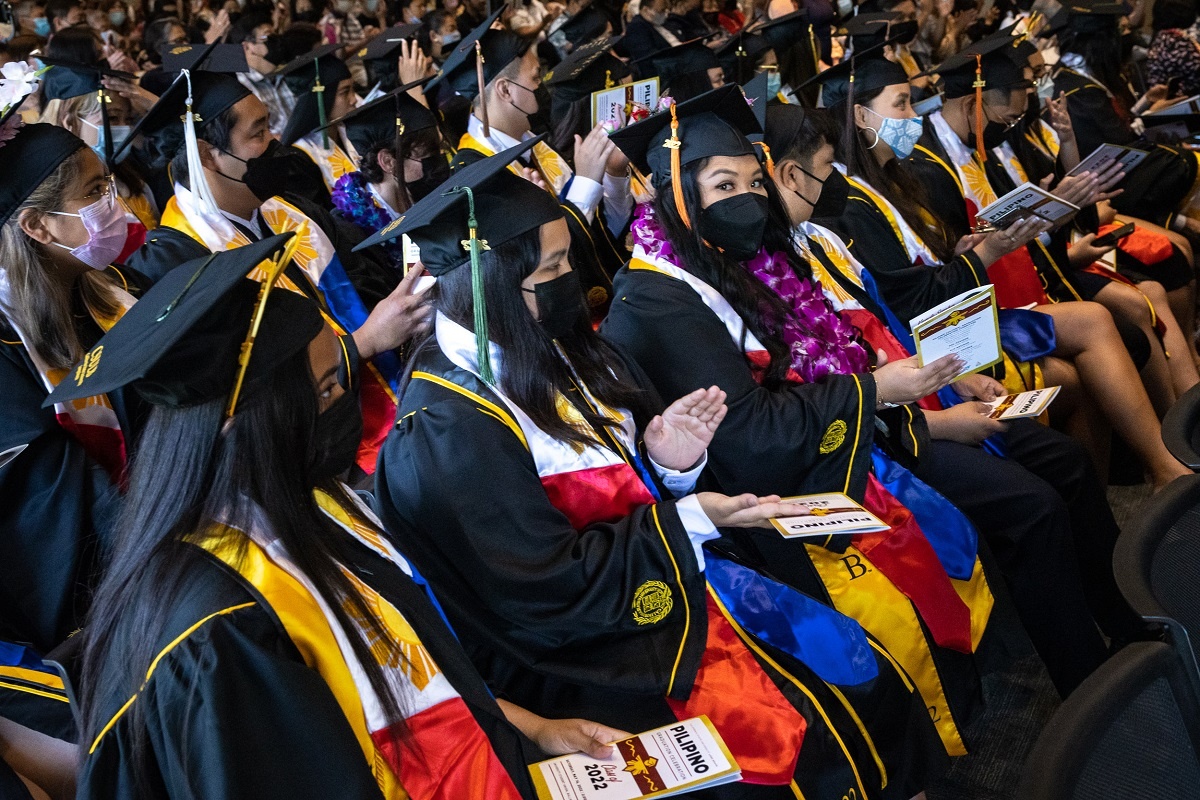 Grads applaud at the  2022 Pilipino Cultural Commencement