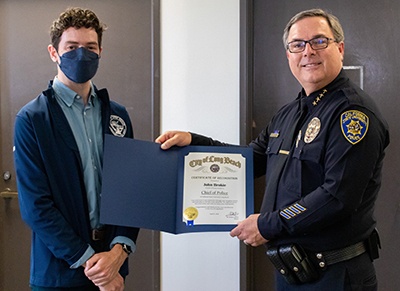police_400x400.jpg John Brockie recieves certificate