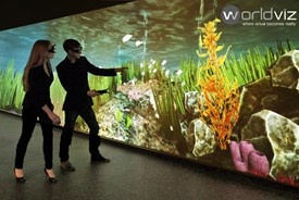 2 people looking at ocean scene on Powerwall