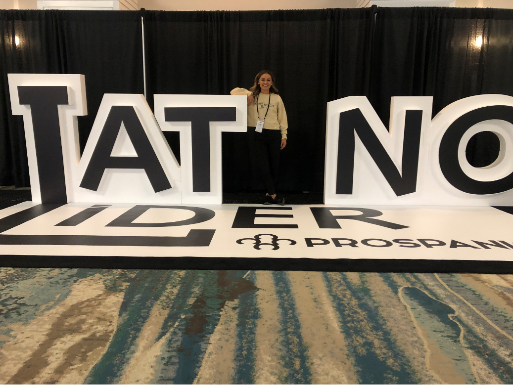 Kaelyn Posing with a Sign