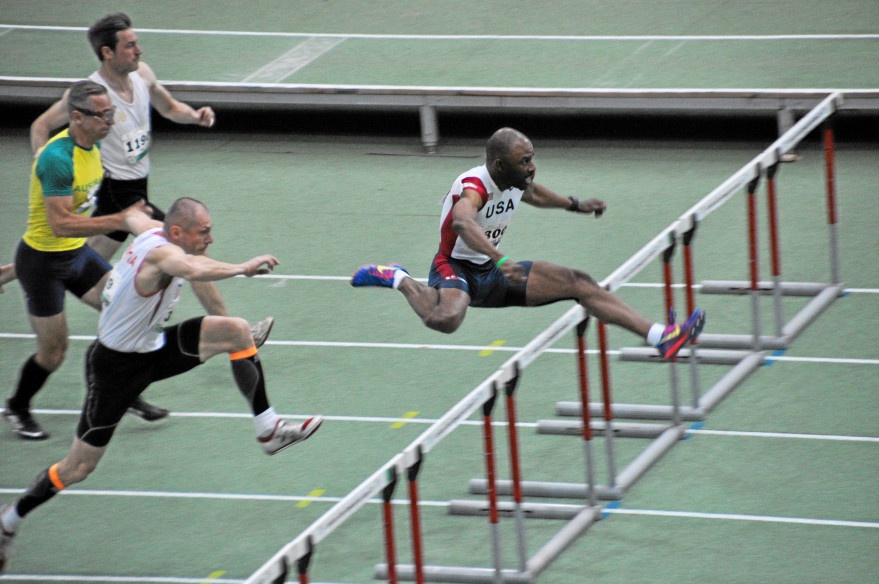 Derek Pye hurdles to victory