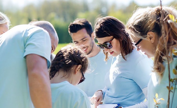 Recreation manager leading outdoor group activity