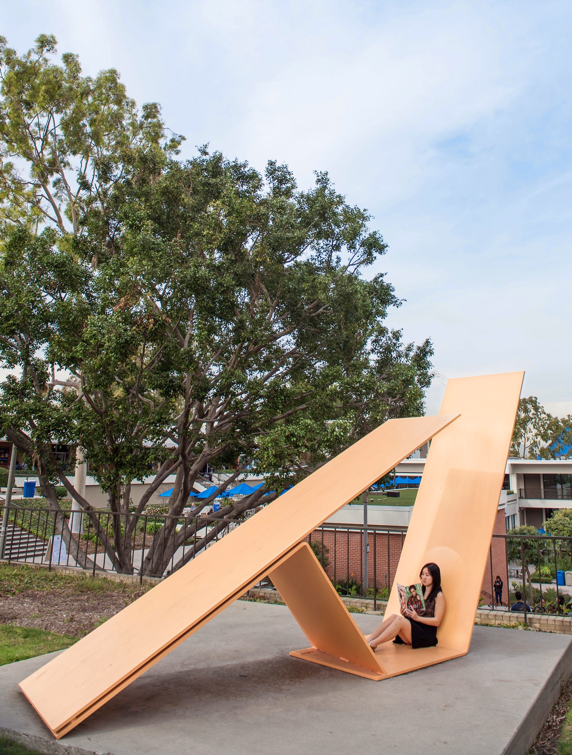 girl sitting in duet sculpture