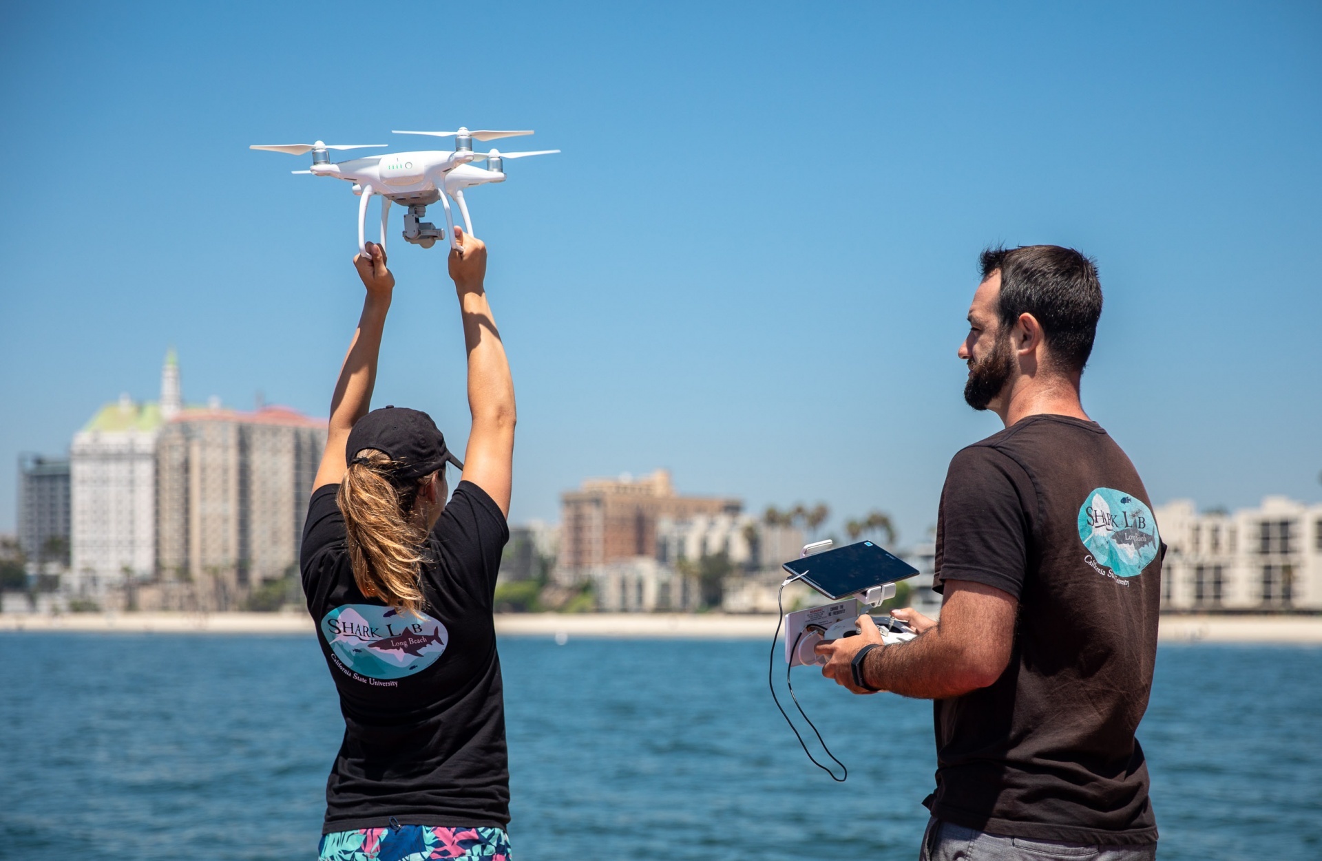 students launch drone off boat