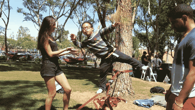 slack-line2.gif Student balances on one foot on a slack line